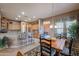 Kitchen with breakfast nook, island, and stainless steel appliances at 20377 W Terrace Ln, Buckeye, AZ 85396