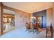 Elegant dining room with a wooden table and blue accent wall at 20377 W Terrace Ln, Buckeye, AZ 85396