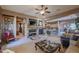 Living room with stone fireplace and built-in entertainment center at 20377 W Terrace Ln, Buckeye, AZ 85396