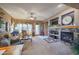 Living room features a stone fireplace and built-in entertainment center at 20377 W Terrace Ln, Buckeye, AZ 85396