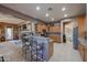 Kitchen features granite countertops, stainless steel appliances, and ample cabinetry at 20377 W Terrace Ln, Buckeye, AZ 85396