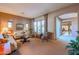 Open living room with comfortable seating, leading to other rooms at 20377 W Terrace Ln, Buckeye, AZ 85396