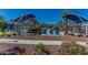 Pool area with blue lounge chairs and shade structures at 20377 W Terrace Ln, Buckeye, AZ 85396