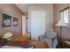 Bright home office featuring a desk, chair, and built-in closet at 20377 W Terrace Ln, Buckeye, AZ 85396