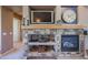 Stone fireplace with built-in shelving and entertainment center at 20377 W Terrace Ln, Buckeye, AZ 85396