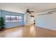 Bright living room with wood-look floors and a view to the backyard at 10418 N 97Th Dr # B, Peoria, AZ 85345