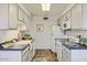 Clean and updated kitchen with white appliances at 10418 N 97Th Dr # B, Peoria, AZ 85345