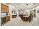 Open concept dining room with a large wooden table, adjacent to kitchen and living room at 3248 S Golden Barrel Ct, Gold Canyon, AZ 85118