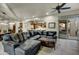 Spacious living room featuring a sectional sofa and access to backyard patio at 3248 S Golden Barrel Ct, Gold Canyon, AZ 85118