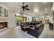 Open living space showcasing a large sectional sofa and fireplace, with views into dining and kitchen areas at 3248 S Golden Barrel Ct, Gold Canyon, AZ 85118