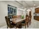 Elegant dining room features a large rustic table and built-in wine storage at 3248 S Golden Barrel Ct, Gold Canyon, AZ 85118