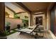 Private patio with lounge chairs and hot tub at 3248 S Golden Barrel Ct, Gold Canyon, AZ 85118
