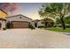 Two-car garage and landscaped front yard at 3248 S Golden Barrel Ct, Gold Canyon, AZ 85118
