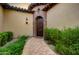 Elegant entryway with a curved walkway and arched doorway at 3248 S Golden Barrel Ct, Gold Canyon, AZ 85118