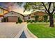 Two-story home with brick facade and landscaped yard at 3248 S Golden Barrel Ct, Gold Canyon, AZ 85118