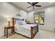 Bright bedroom with wood bed frame and large window at 3248 S Golden Barrel Ct, Gold Canyon, AZ 85118