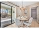 Bright dining area with sliding door access to patio at 17409 N Conquistador Dr, Sun City West, AZ 85375