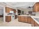 Kitchen features island and ample wood cabinetry at 17409 N Conquistador Dr, Sun City West, AZ 85375