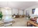 Open concept living room and dining area with a crystal chandelier at 17409 N Conquistador Dr, Sun City West, AZ 85375