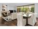 Spacious living area with hardwood floors and balcony access at 7175 E Camelback Rd # 202, Scottsdale, AZ 85251
