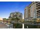 Upscale building with water views and palm trees at 7175 E Camelback Rd # 202, Scottsdale, AZ 85251