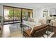 Bright living room with balcony access and modern furniture at 7175 E Camelback Rd # 202, Scottsdale, AZ 85251
