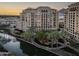 High rise building with water views at sunset at 7175 E Camelback Rd # 202, Scottsdale, AZ 85251
