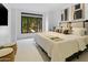 Spacious bedroom with large windows, plush bedding, and ample natural light at 7175 E Camelback Rd # 202, Scottsdale, AZ 85251
