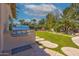 Outdoor kitchen with built-in grill and stone pathway at 5455 E Berneil Dr, Paradise Valley, AZ 85253