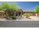 Single story home with a two-car garage and desert landscaping at 41618 N Anthem Ridge Dr, Phoenix, AZ 85086