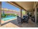 Inviting pool area with patio furniture under covered patio at 41618 N Anthem Ridge Dr, Phoenix, AZ 85086