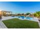 Relaxing pool area with a pergola and grassy area at 22006 E Alyssa Rd, Queen Creek, AZ 85142