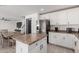 Kitchen features an island, stainless steel appliances, and views into dining area at 794 E Christopher St, San Tan Valley, AZ 85140