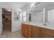 Bathroom with double vanity, walk-in shower and separate tub at 794 E Christopher St, San Tan Valley, AZ 85140