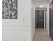 Clean hallway with light gray walls and wood flooring at 794 E Christopher St, San Tan Valley, AZ 85140