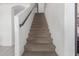 Carpeted staircase leading to the upper level at 794 E Christopher St, San Tan Valley, AZ 85140