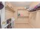 Large walk-in closet with shelving and hanging rods at 794 E Christopher St, San Tan Valley, AZ 85140