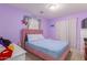 Bedroom with double bed, pink headboard and window coverings at 794 E Christopher St, San Tan Valley, AZ 85140