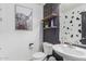 Stylish bathroom with a pedestal sink, toilet and modern decor at 794 E Christopher St, San Tan Valley, AZ 85140