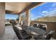 Covered patio with an outdoor dining set and a view at 37887 N Boulder View Dr, Scottsdale, AZ 85262