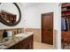 Bathroom with walk-in closet and granite countertop at 40740 N Longhorn Dr, Scottsdale, AZ 85262