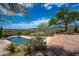 Inviting pool and flagstone patio with mountain backdrop at 40740 N Longhorn Dr, Scottsdale, AZ 85262