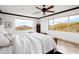 Spacious bedroom featuring mountain views and a ceiling fan at 40740 N Longhorn Dr, Scottsdale, AZ 85262