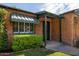 Front entry of brick home with green awning at 3329 N 17Th Dr, Phoenix, AZ 85015