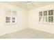 Well-lit bedroom with ceiling fan and carpeted floor at 3329 N 17Th Dr, Phoenix, AZ 85015