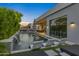 Luxury pool area with patio furniture and a view of the home's interior at 6950 E Cactus Wren Rd, Paradise Valley, AZ 85253