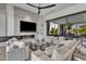 Spacious living room featuring a fireplace and large TV at 6950 E Cactus Wren Rd, Paradise Valley, AZ 85253