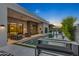 Modern backyard with a rectangular pool, patio furniture, and an outdoor kitchen at 6950 E Cactus Wren Rd, Paradise Valley, AZ 85253