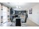 Dining area with glass table and four black chairs near kitchen at 4724 W Lydia Ln, Laveen, AZ 85339