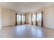 Living room with tile floors, multiple windows, and a view to the outside at 860 Yaqui Dr, Wickenburg, AZ 85390